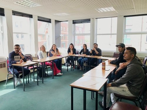 Group of English course students during the class.